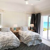 Oceanfront Haven: Elegant Estate With Private Deck