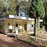 A Detached Bungalow With Outdoor Fireplace, Covered Terrace and Pond i