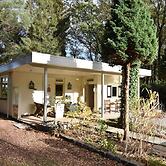 A Detached Bungalow With Outdoor Fireplace, Covered Terrace and Pond i