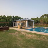 ELIVAAS 5-BHK with Luxe Mudhouses, Tents, Pond & Pvt Pool | Kaimalgarh
