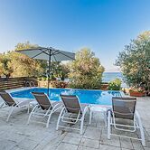 Deja Blue Beach Pool House by Estia