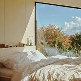 Raus | Cabins mit Feldblick + Saunazugang