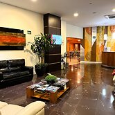 Le Village Flats e Hotel