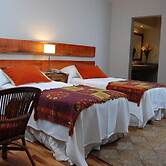 Rio Arriba Suites Apartments y Resto