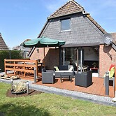 Snug Holiday Home in Herkingen with Hot Tub in Garden