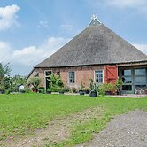 Farmhouse by Lauwers River With Rowing Boat