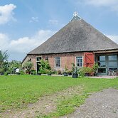 Farmhouse by Lauwers River With Rowing Boat