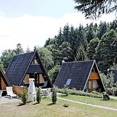 Wooden Chalet with Terrace near Swimming Lake