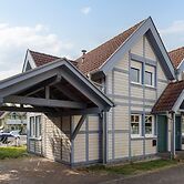 Cozy Holiday Home with Wood Burning Stove near Water