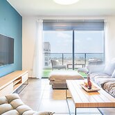 Vibrant Seaside Stay with Balcony by Sea N' Rent