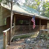 One bedroom, one bath log-sided cottage with private hot tub on Lake O