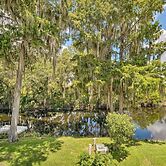Old Florida Setting w/ Kayaks & Fishing Poles