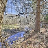 Quaint Creekside Home w/ Spacious Deck & Yard