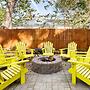 Vibrant, Colorful Condo Building With Backyard Firepit and Games