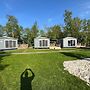 Chalet With Play Equipment, on a Holiday Park