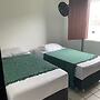 Quarto com 2 camas de solteiros