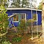 Bungalow am See mit Ruderboot in Klein Labenz