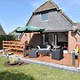 Snug Holiday Home in Herkingen with Hot Tub in Garden