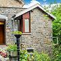 A Small Studio of a Nature Stone House