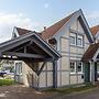 Cozy Holiday Home with Wood Burning Stove near Water