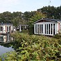 Comfy Chalet With a Dishwasher, Directly on a Pond