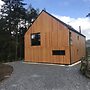 Red Stag With Stunning Loch and Waterfall View