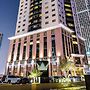 Magnum Hotel & Suites West Bay