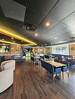 Merit Hotel & Suites