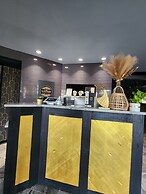 Merit Hotel & Suites