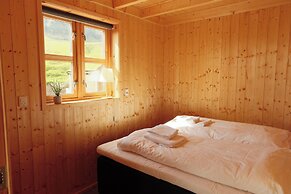 Múlafossur Cottages near Waterfall