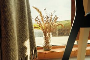 Múlafossur Cottages near Waterfall