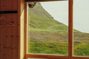 Múlafossur Cottages near Waterfall