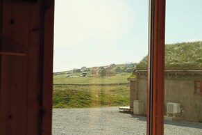 Múlafossur Cottages near Waterfall