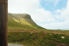 Múlafossur Cottages near Waterfall