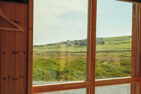 Múlafossur Cottages near Waterfall