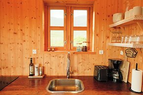 Múlafossur Cottages near Waterfall