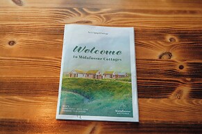 Múlafossur Cottages near Waterfall