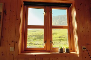 Múlafossur Cottages near Waterfall