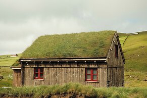 Múlafossur Cottages near Waterfall