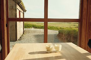 Múlafossur Cottages near Waterfall