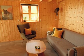 Múlafossur Cottages near Waterfall