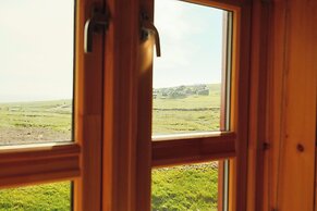 Múlafossur Cottages near Waterfall