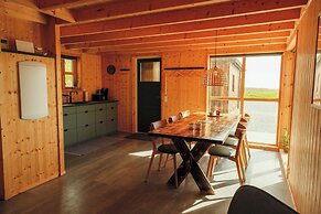 Múlafossur Cottages near Waterfall