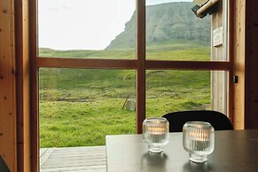 Múlafossur Cottages near Waterfall