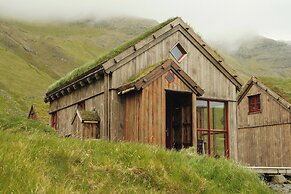 Múlafossur Cottages near Waterfall
