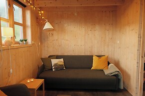 Múlafossur Cottages near Waterfall