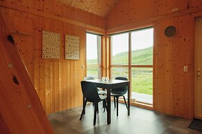 Múlafossur Cottages near Waterfall