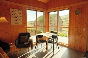 Múlafossur Cottages near Waterfall