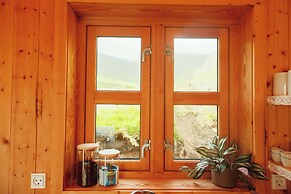 Múlafossur Cottages near Waterfall