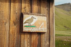 Múlafossur Cottages near Waterfall